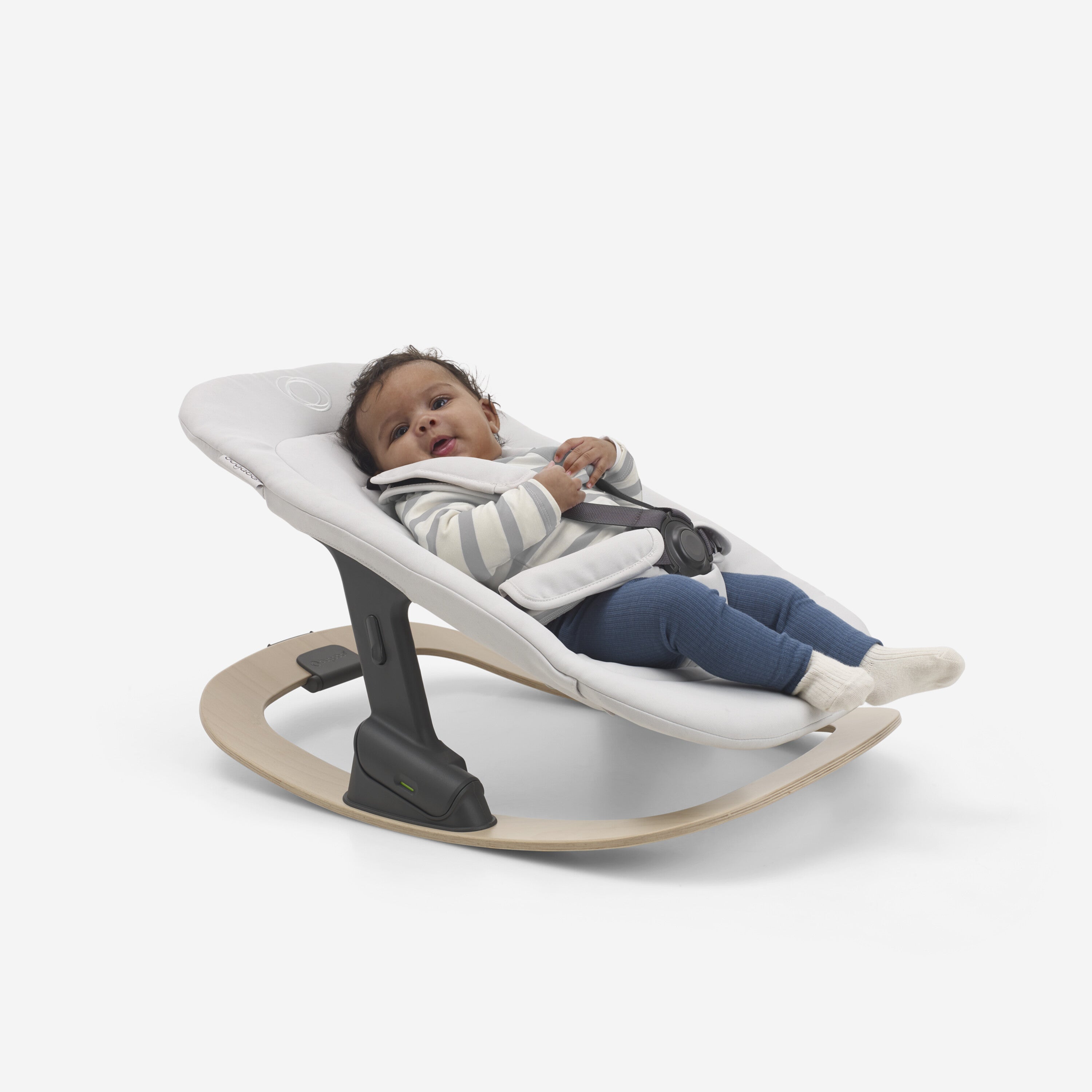 Bugaboo Giraffe Baby Rocker Polar white with baby in it